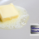 pat of butter melting on a white surface